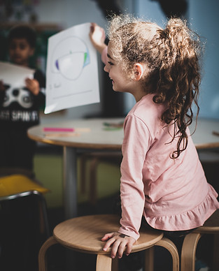 Child drawing in classroom