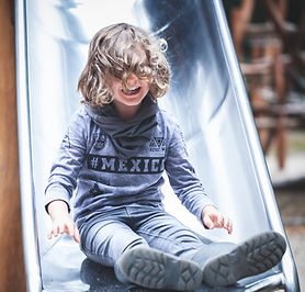 Happy child on a slide